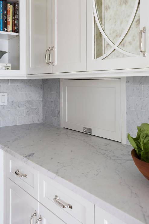 White kitchen designed with a small storage appliance garage or an organized and easily accessible feature.
