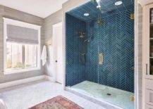 blue chevron tile walk in shower with gold shower kit rainfall shower head