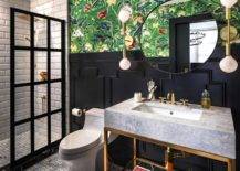 bright floral wallpaper navy blue wainscotting decorative bathroom basement glass shower black frames white subway tile gold and marble sink