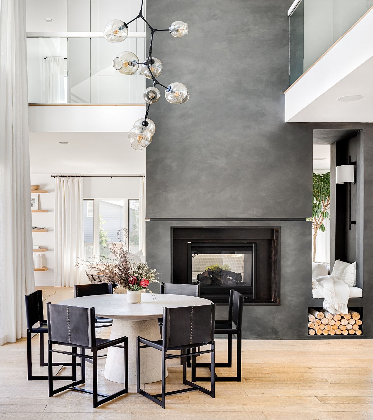 Fabulous-fireplace-in-gray-cement-becomes-the-focal-point-of-this-amazing-dining-space-24172