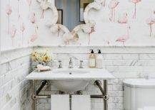 flamingo wallpaper in half bathroom with decorative scroll mirror and pedestal sink