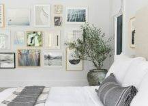 framed art picture gallery wall hanging by bed white bedding
