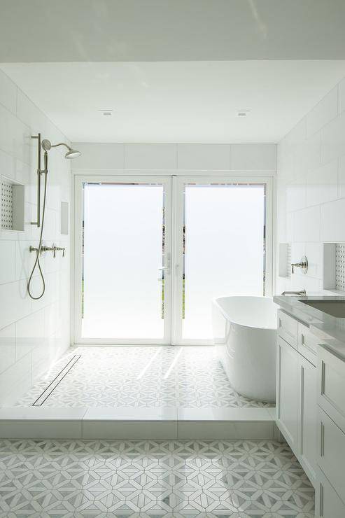 double frosted glass doors walk in shower with gray mosaic tile