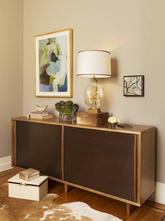 A girly modern showcase of Swedish and French antiques, America mid-century and flea market finds paired with modern items and art. The den features a moth lamp and several unique finds.